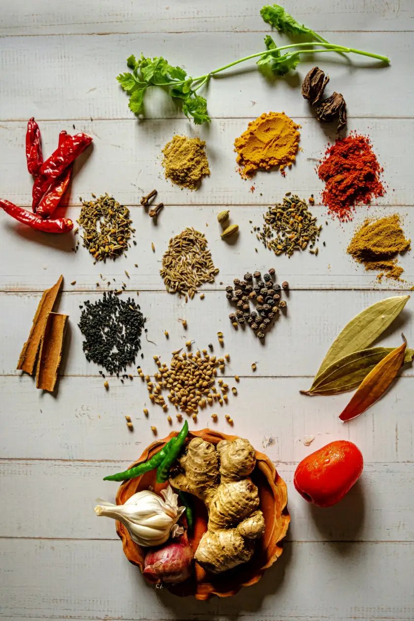 Spices, herbs and fresh ingredients on a wooden table
